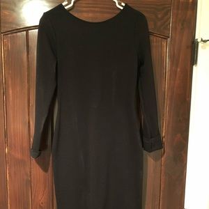 Lulu’s black long sleeve dress, with exposed back.